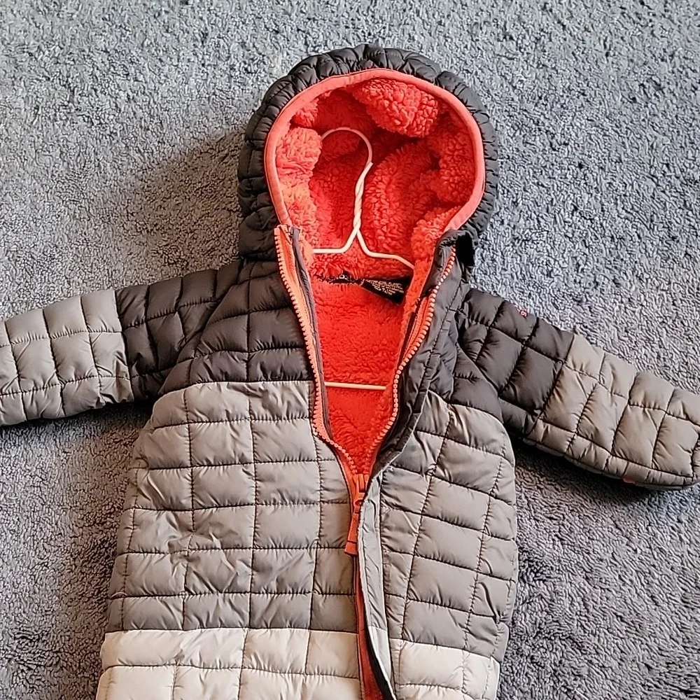 Snozu infant snowsuit, 3-6 months. Different shades of gray with orange lining.